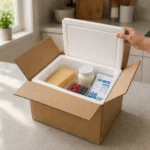 Open EPS-lined insulated shipping box packed with chilled food and coolant